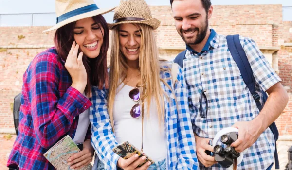 group happy friends looking cellphone