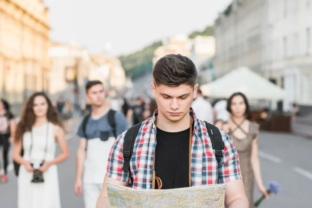 man walking street with map (1)