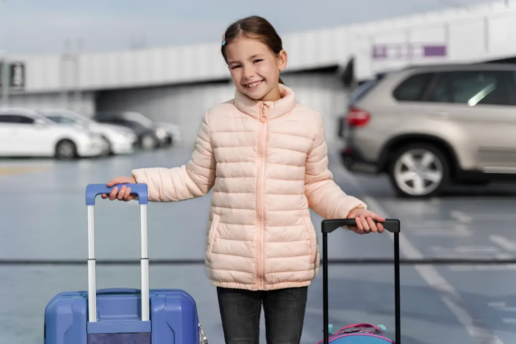 medium shot smiley girl holding baggage (1)