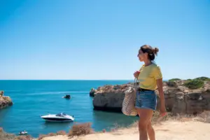 young woman traveling without covid by sea