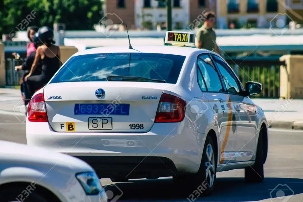 seville spain september taxi driving through the streets of seville during the coronavirus