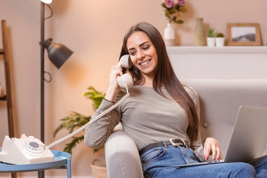 woman talking vintage telephone