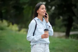 medium shot woman talking phone ()