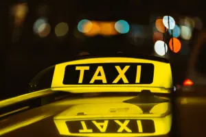 black yellow sign taxi night placed top car